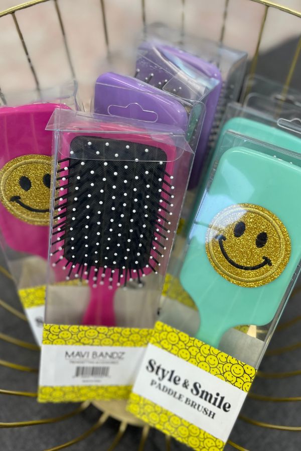 Paddle hair brushes with glitter smiley face in assorted colors at The Dance Shop Long Island