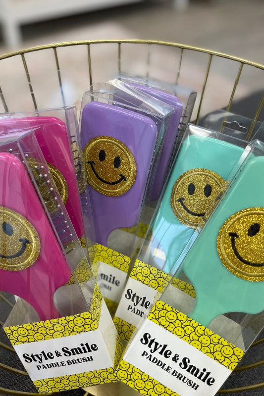 Varsity glitter smiley face paddle hair brush in assorted colors at The Dance Shop Long Island